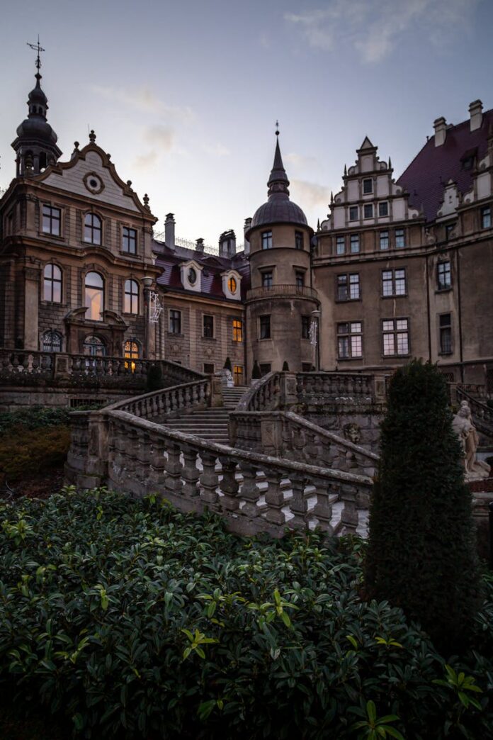 Stunning dusk view of the Gothic Revival castle in Moszna, Poland.